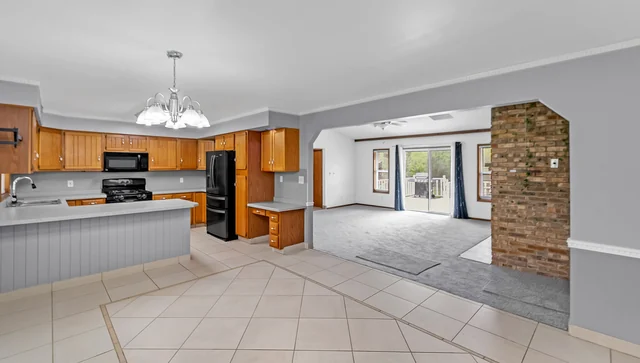 Kitchen with wood cabinets in the Davison ranch home