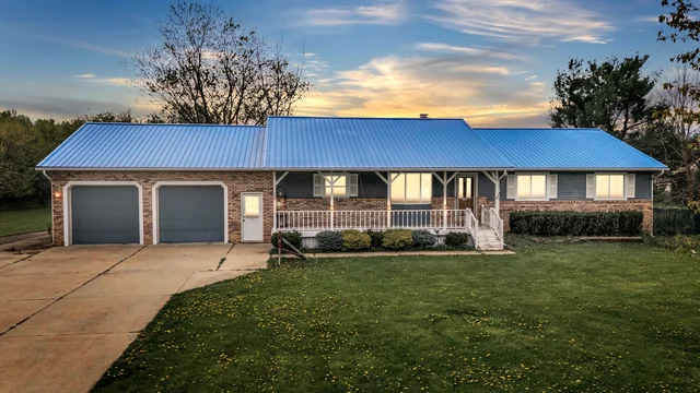 Ranch home with a blue roof in Davison