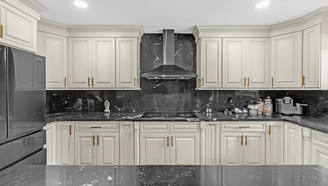 Remodeled kitchen with white cabinets in the Shelby Township ranch