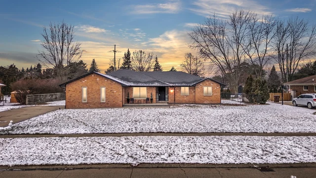 All-brick ranch in Shelby Township at sunset