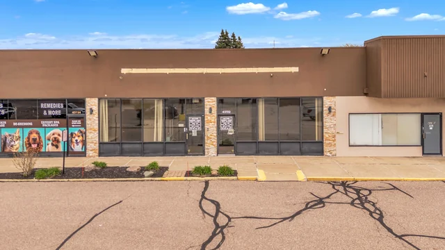 Plaza storefront with large windows in Sterling Heights