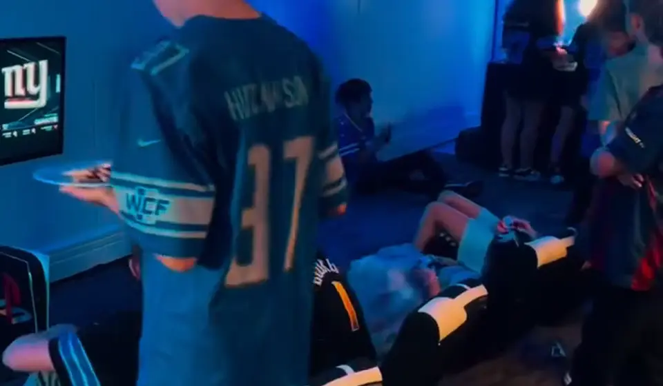 Teens gaming in a blue-lit event room